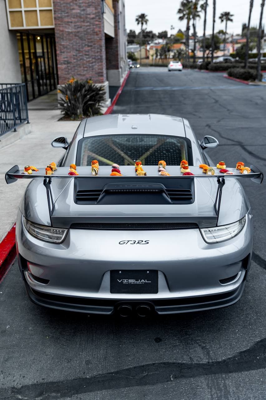 Porsche GT3 RS with omakase sushi bar on rear wing