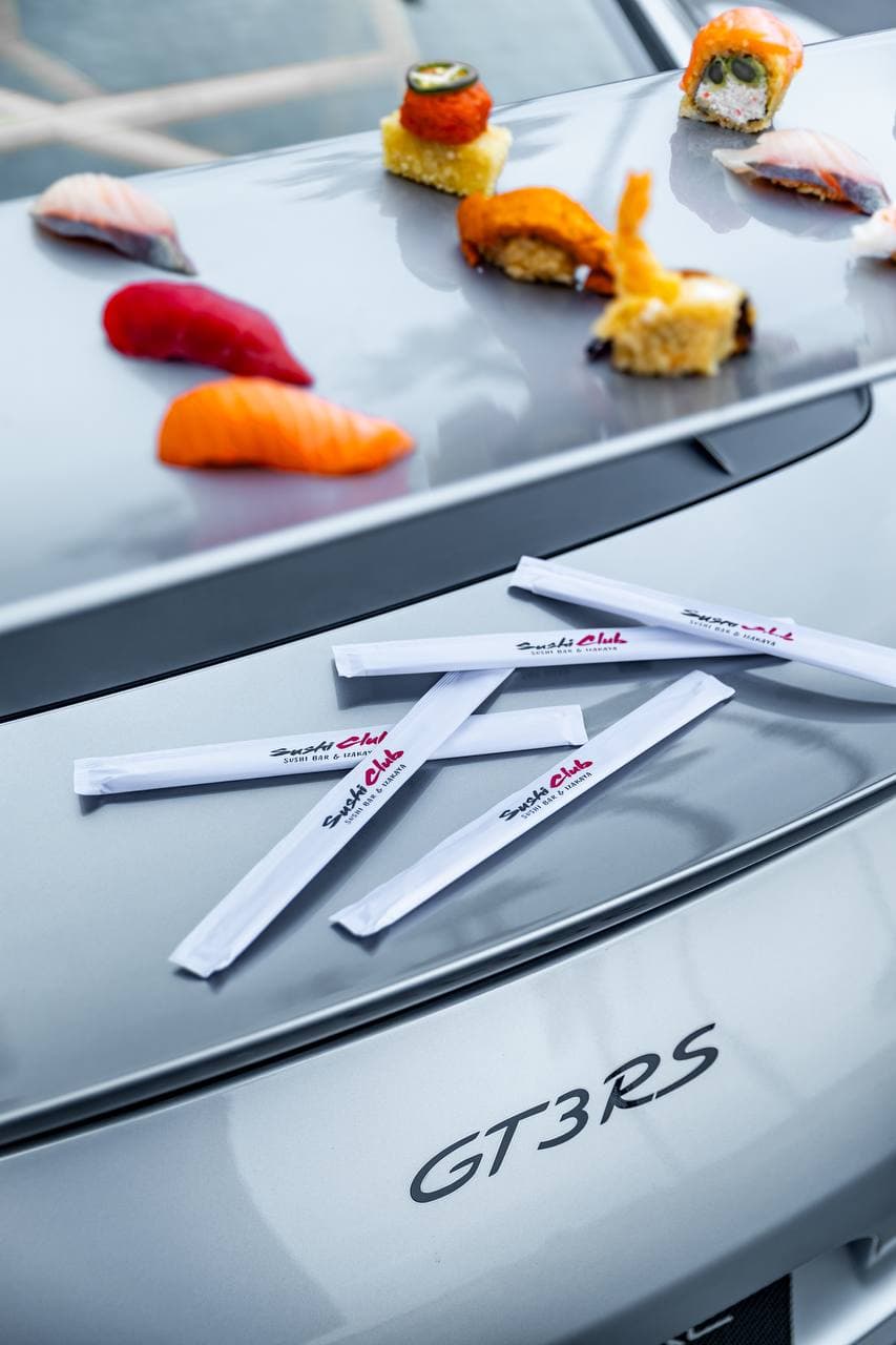 GT3 RS wing with branded Sushi Club chopsticks and nigiri