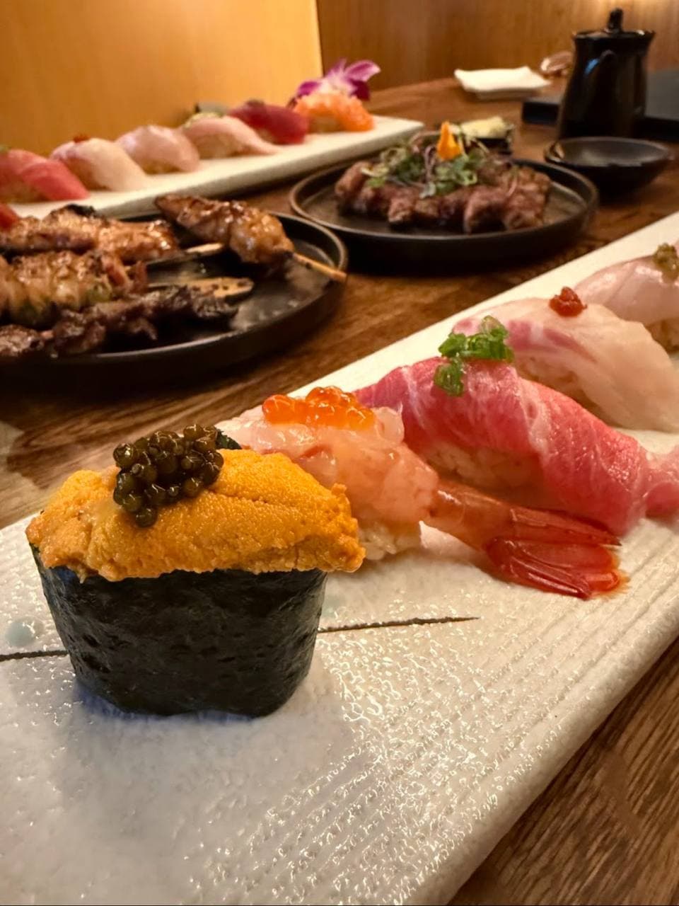 Uni gunkan, salmon, and sweet shrimp at the sushi counter